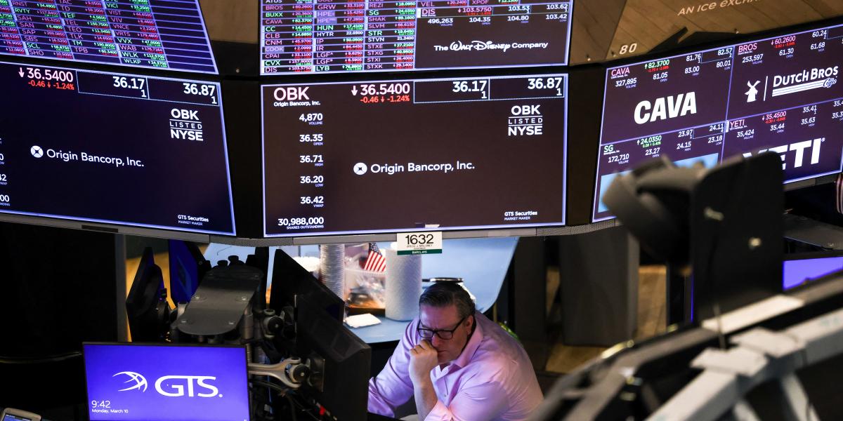  A trader works on the floor of the New York Stock Exchange (NYSE) at the opening bell in New York City on March 10, 2025. 