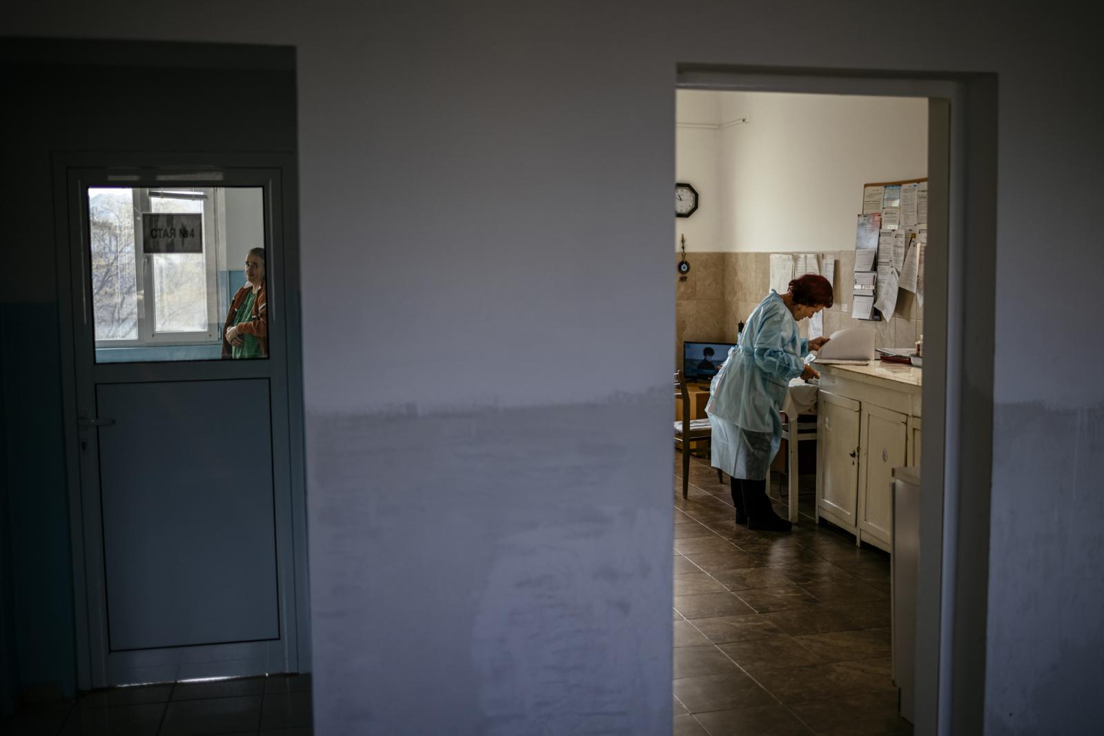 This picture taken on January 20, 2021 shows Bulgarian Infection disease specialist Dr Maria Bogoeva, 82, taking a short break during her shift in a Covid-19 unit in the hospital of Doupnitsa, a municipality with 50,000 inhabitants which is desperately la