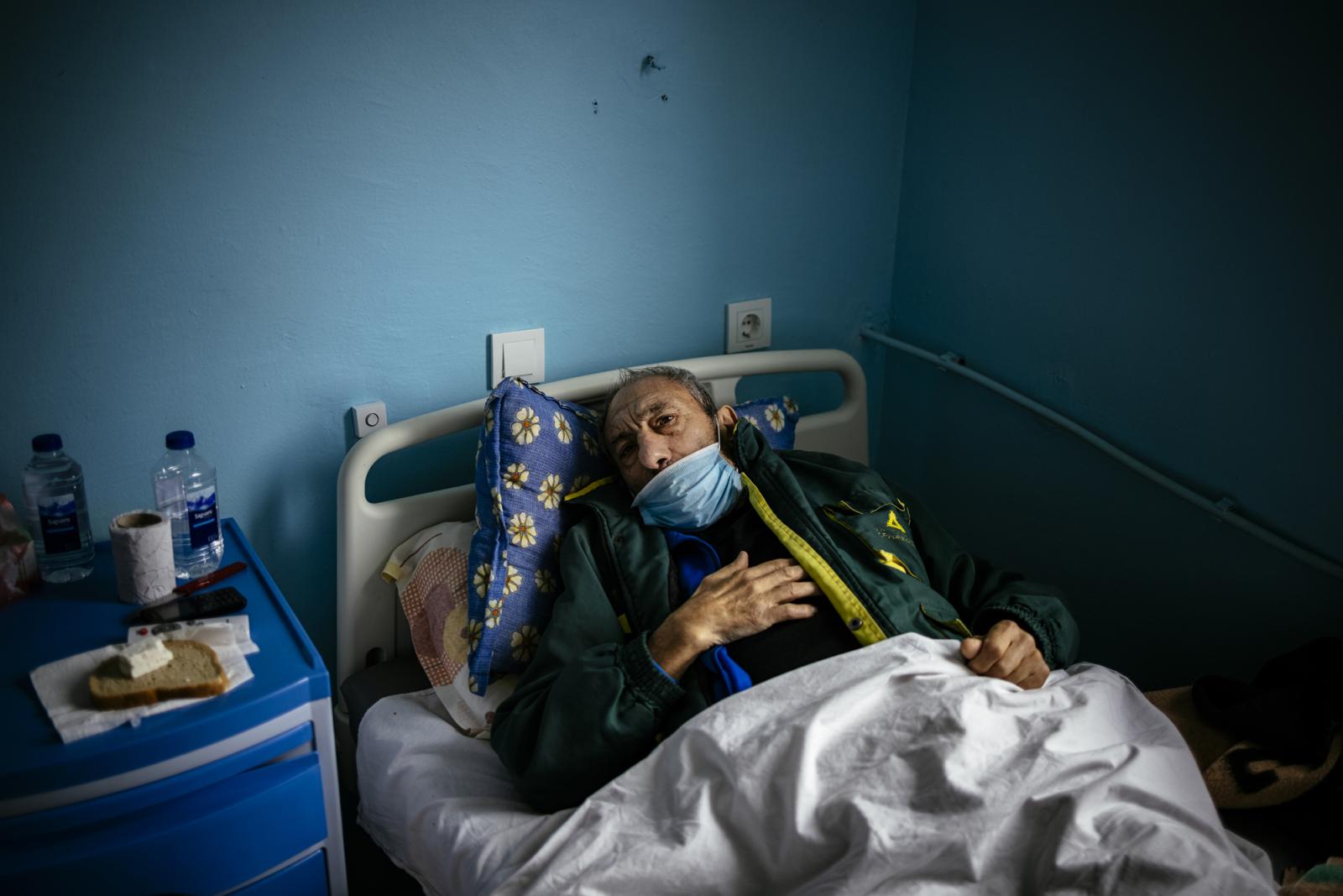 This picture taken on January 20, 2021 shows Bulgarian Infection disease specialist Dr Maria Bogoeva, 82, taking a short break during her shift in a Covid-19 unit in the hospital of Doupnitsa, a municipality with 50,000 inhabitants which is desperately la