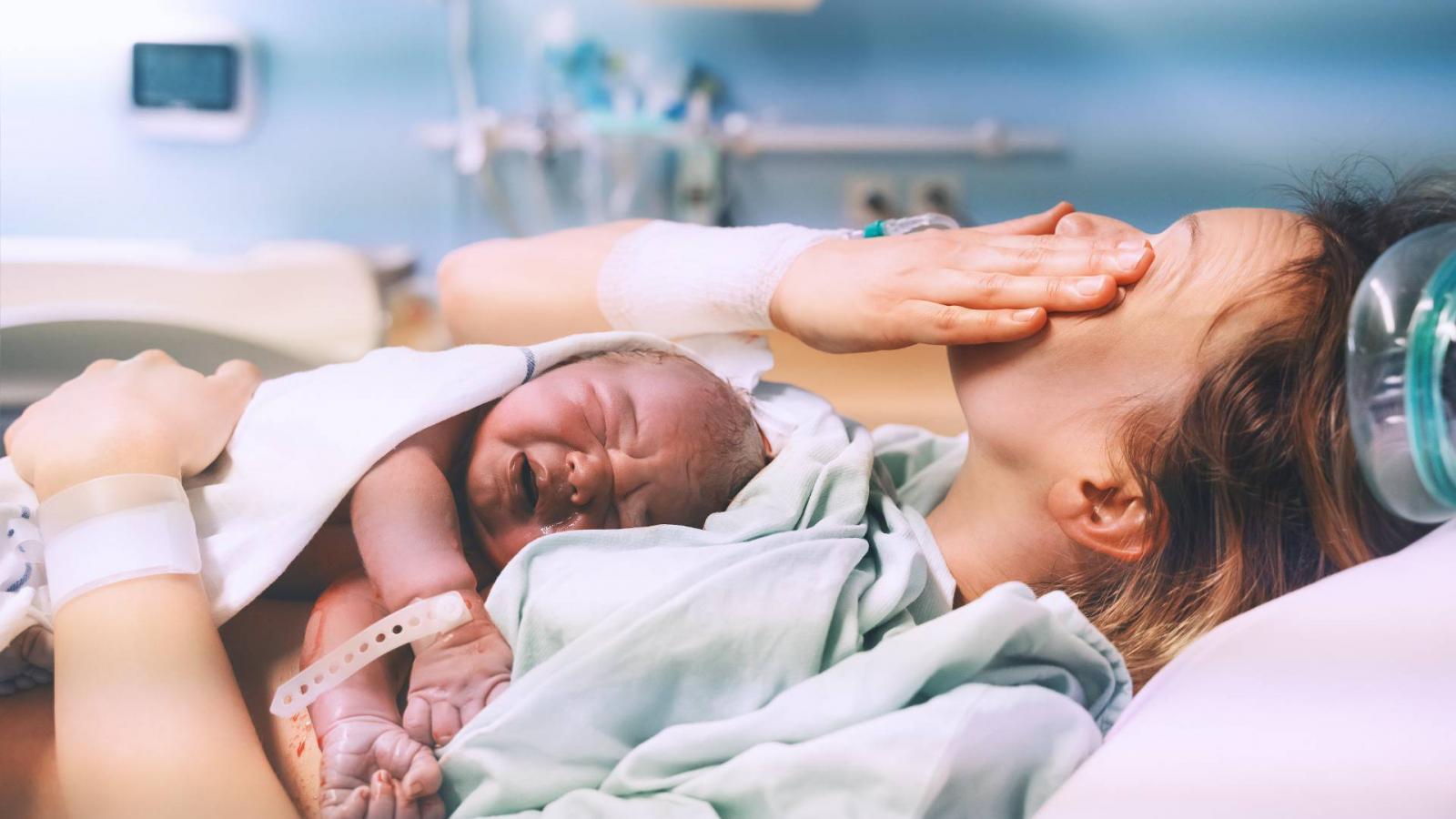 Mother,And,Newborn.,Child,Birth,In,Maternity,Hospital.,Young,Mom