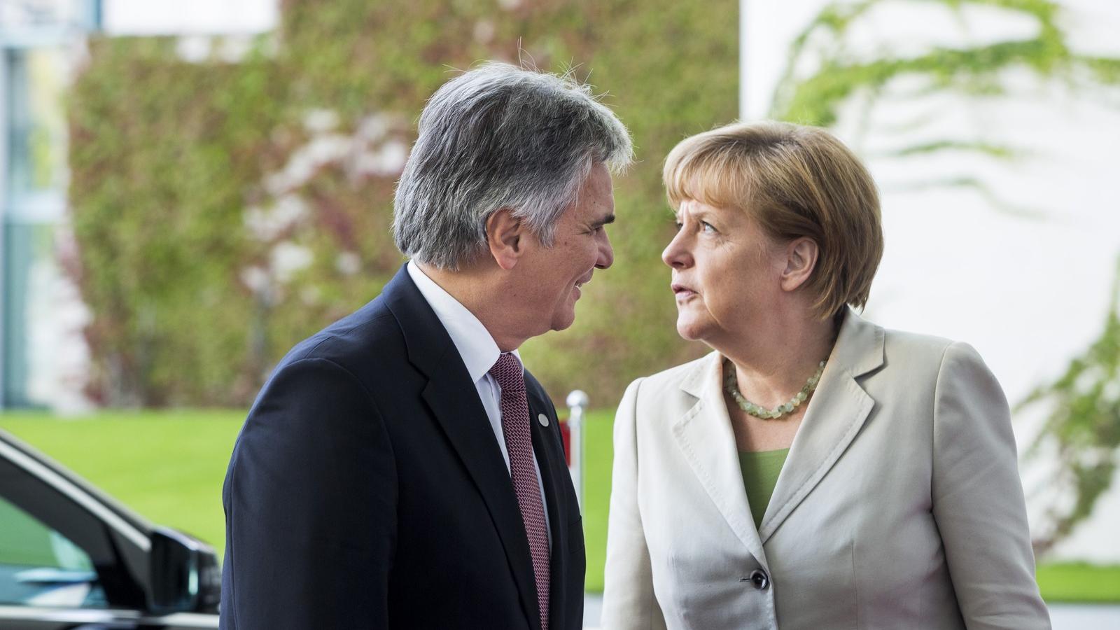 Werner Faymann és Angela Merkel Fotó: Medence/Getty Images Hírek