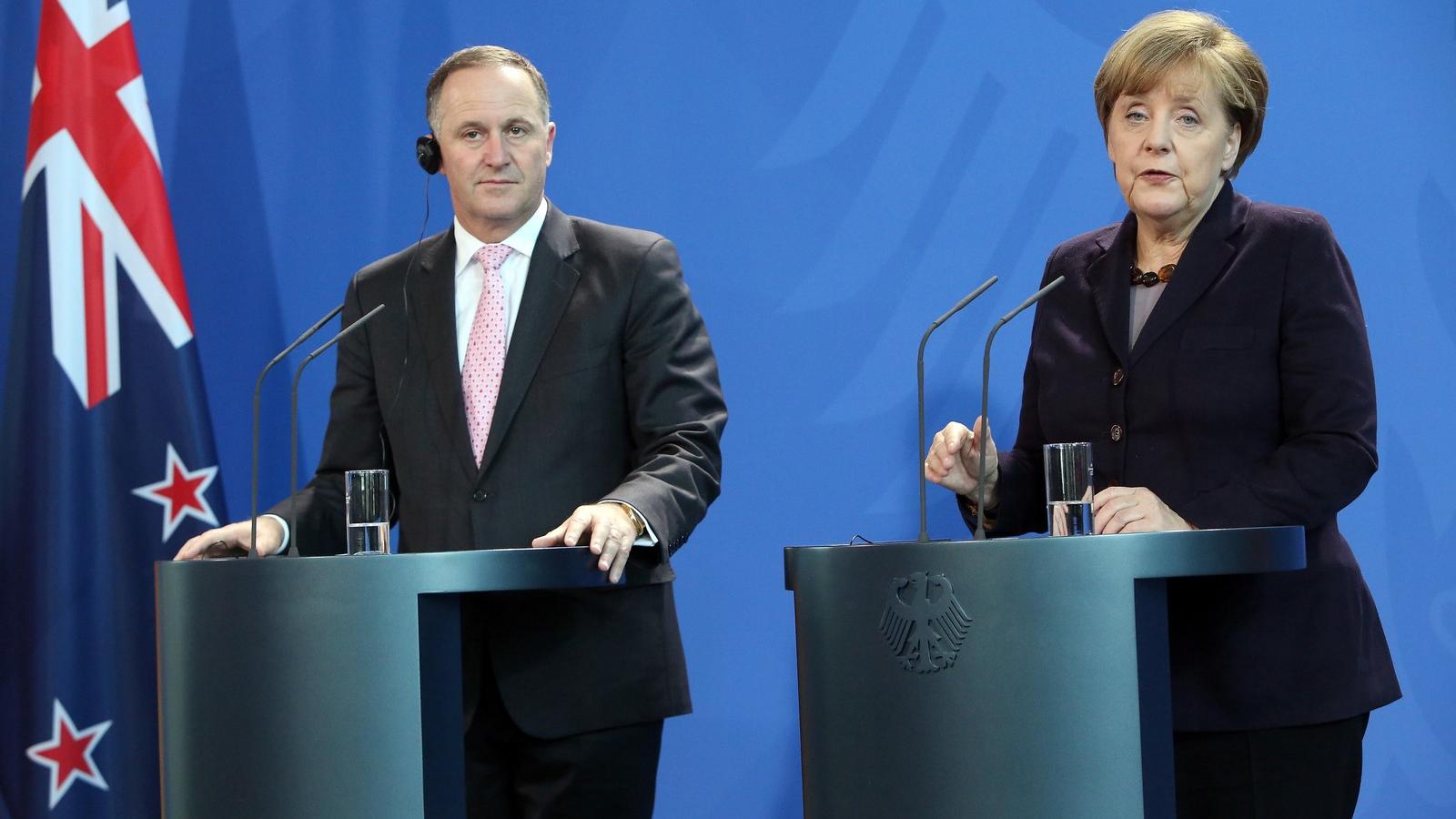 Merkel John Key miniszterelnökkel. FOTÓ: Adam Berry/Getty Images