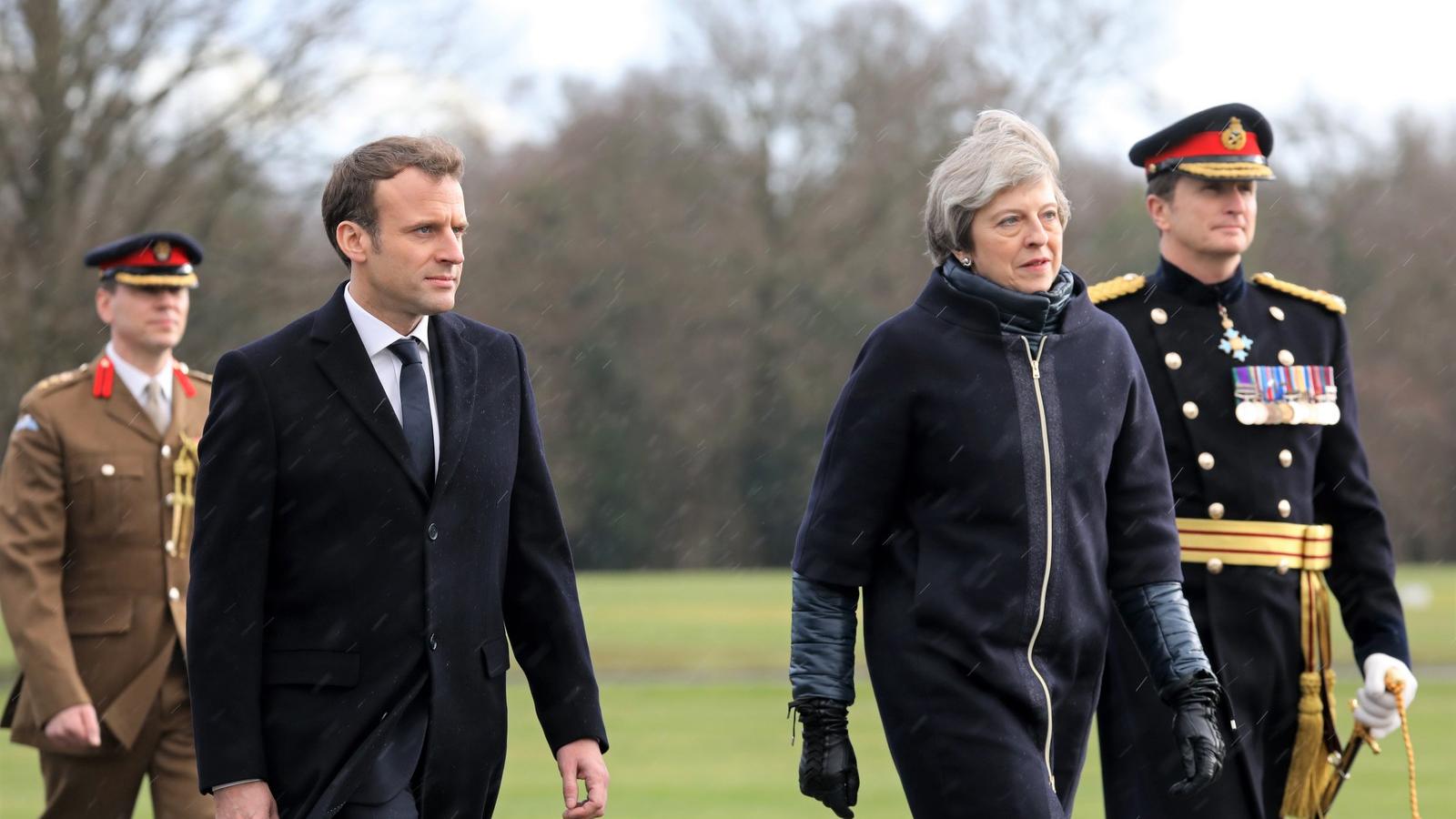 Macron és May: a hűvös nyugat-európai időjárás nem zavarta meg a tárgyalások meleg, bensőséges hangulatát Fotó: AFP/Ludovic Mari